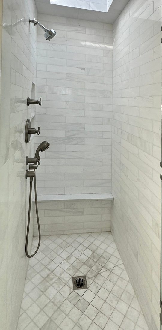 Marble shower before restoration: stained, dull floor and walls