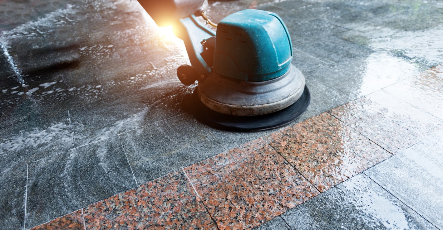 Cleaning the floor with machine